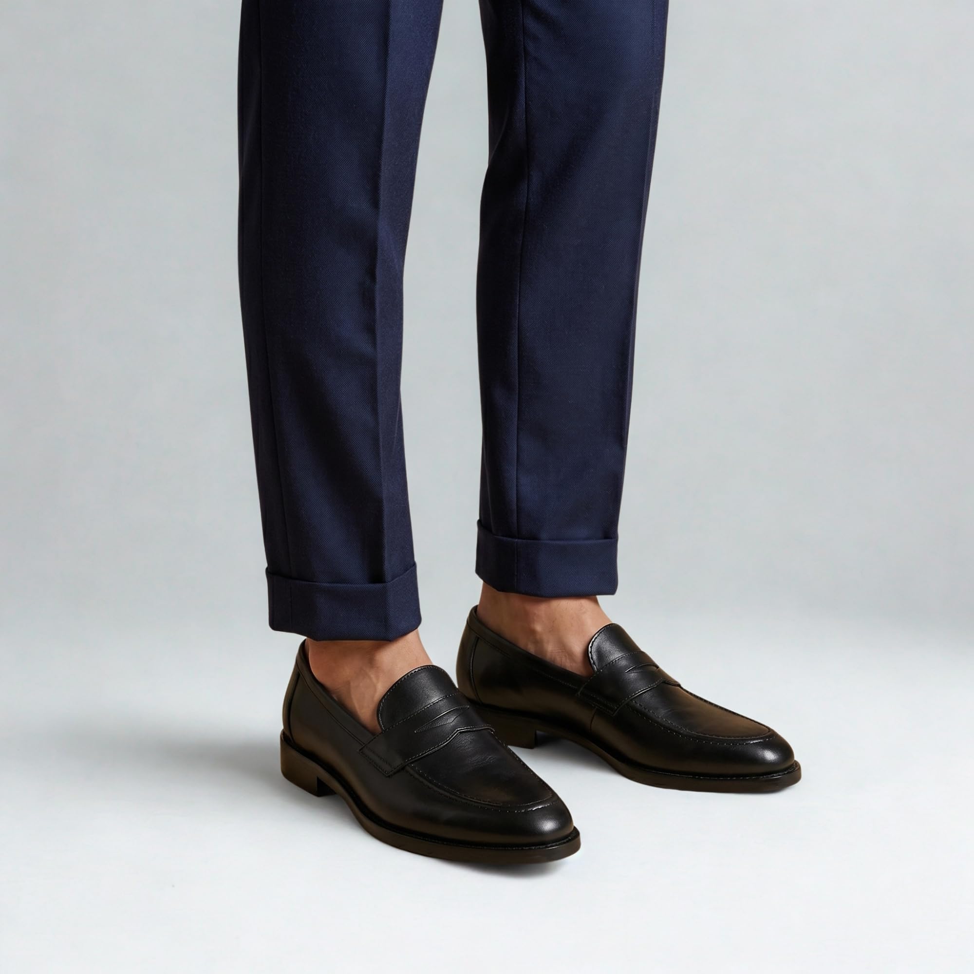 Men's Ventor leather penny loafers styled with smart trousers