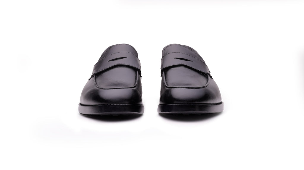 Front view of QUIVE London Bending men's black leather penny loafers