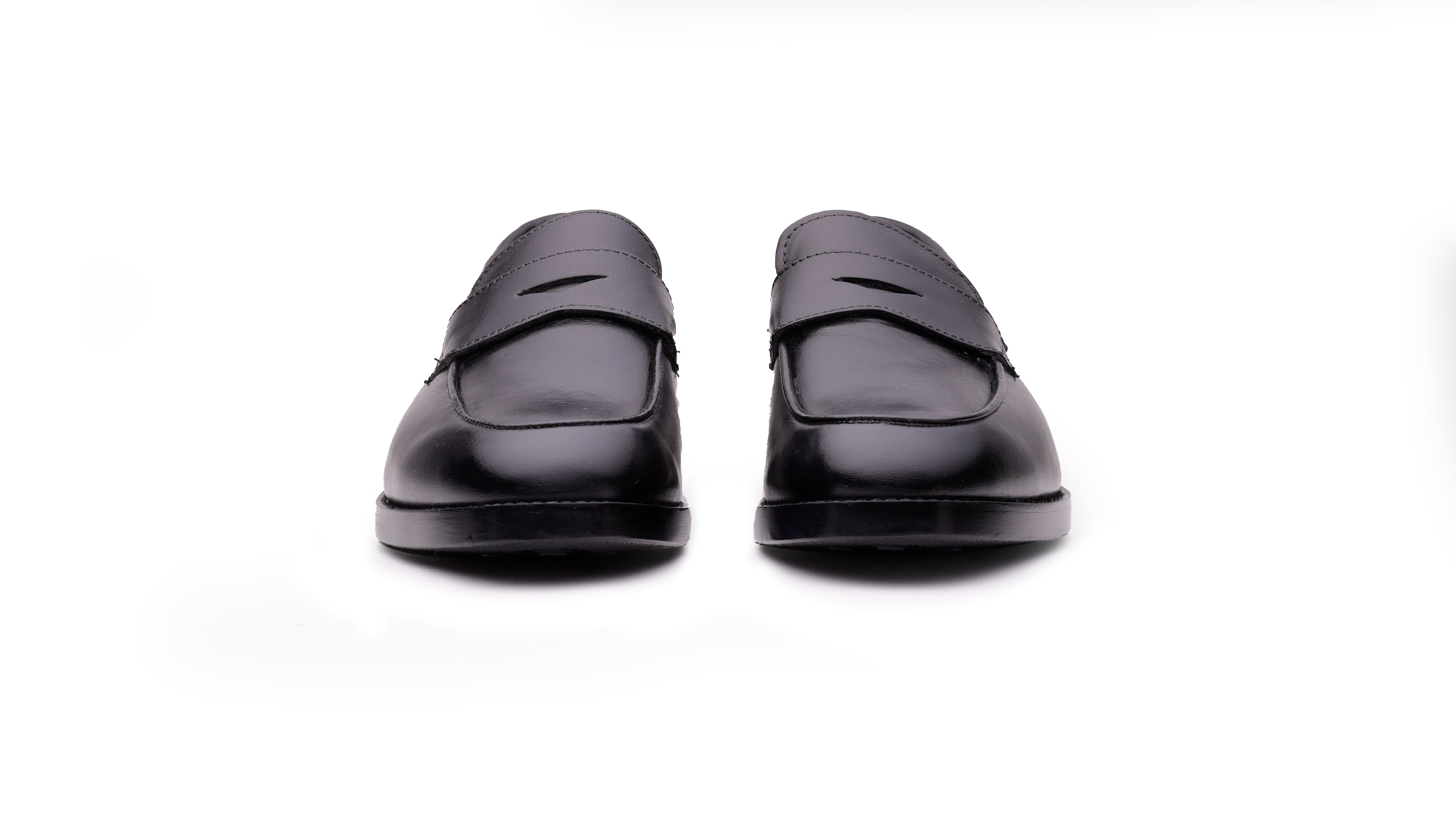 Front view of QUIVE London Bending men's black leather penny loafers