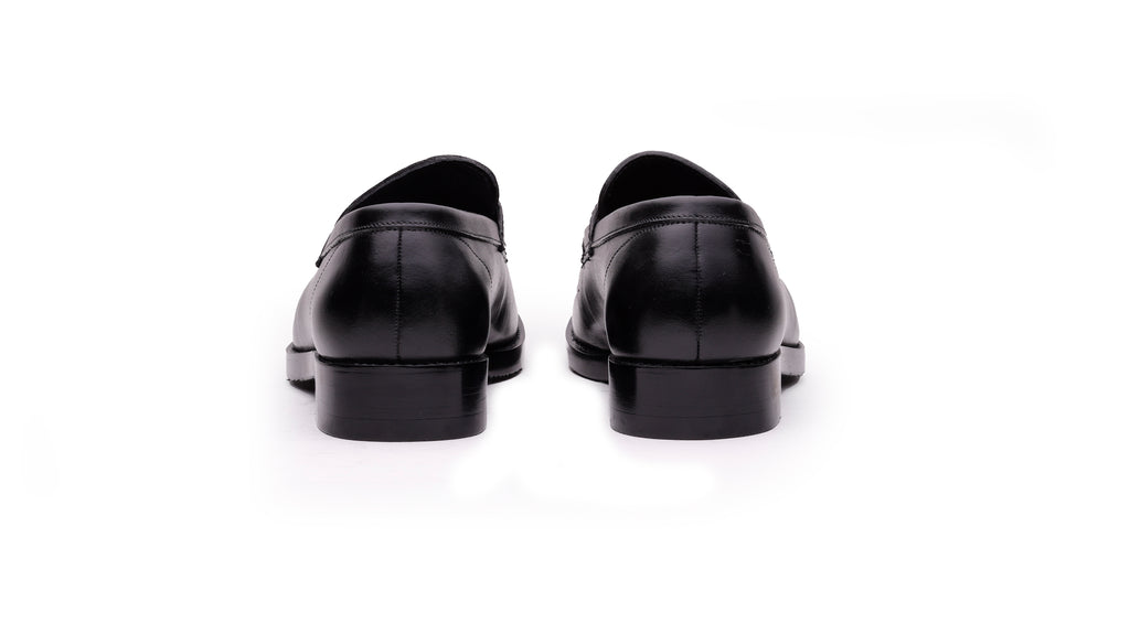 Rear view of QUIVE London Bending men's black leather penny loafers