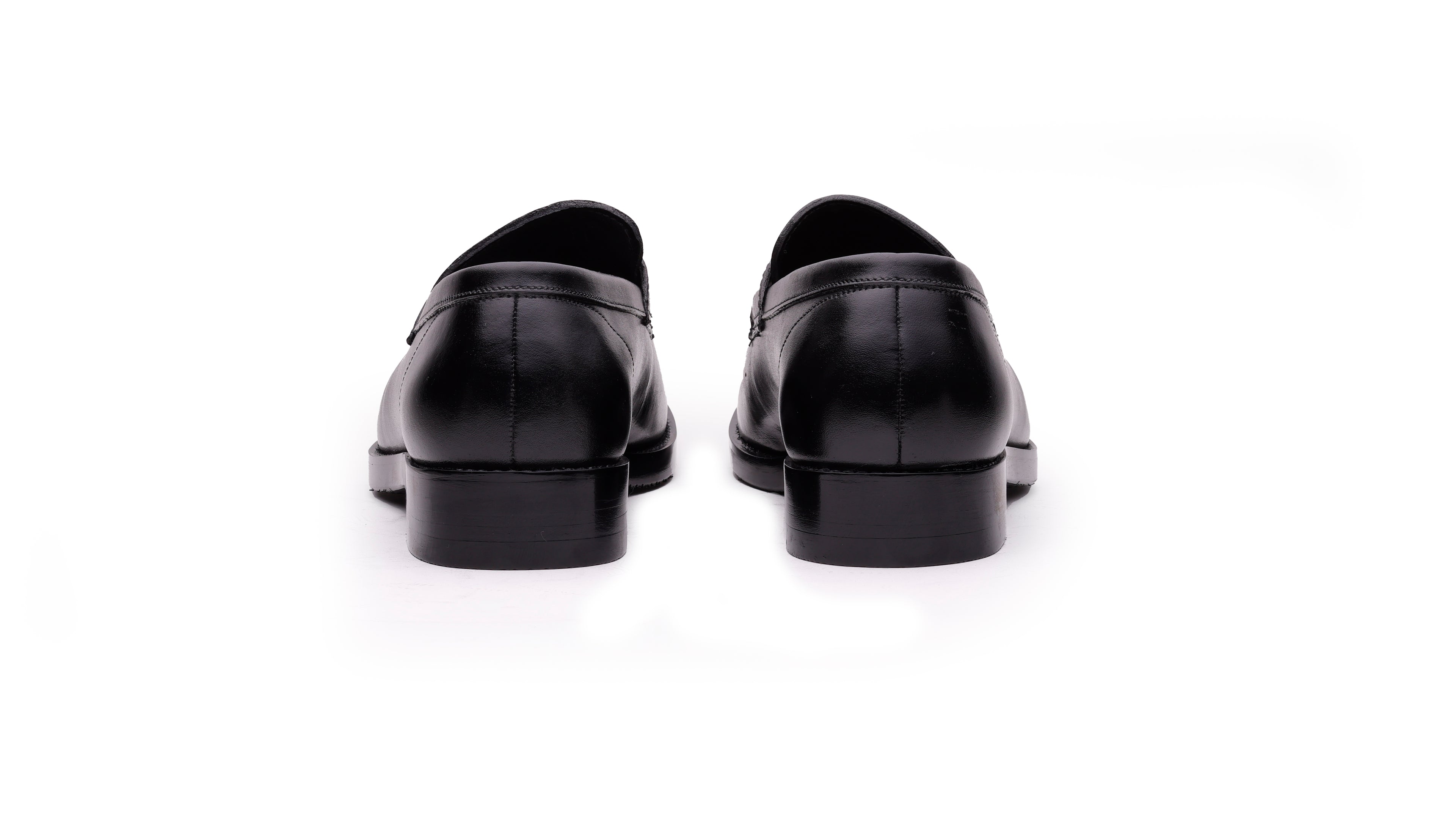Rear view of QUIVE London Bending men's black leather penny loafers