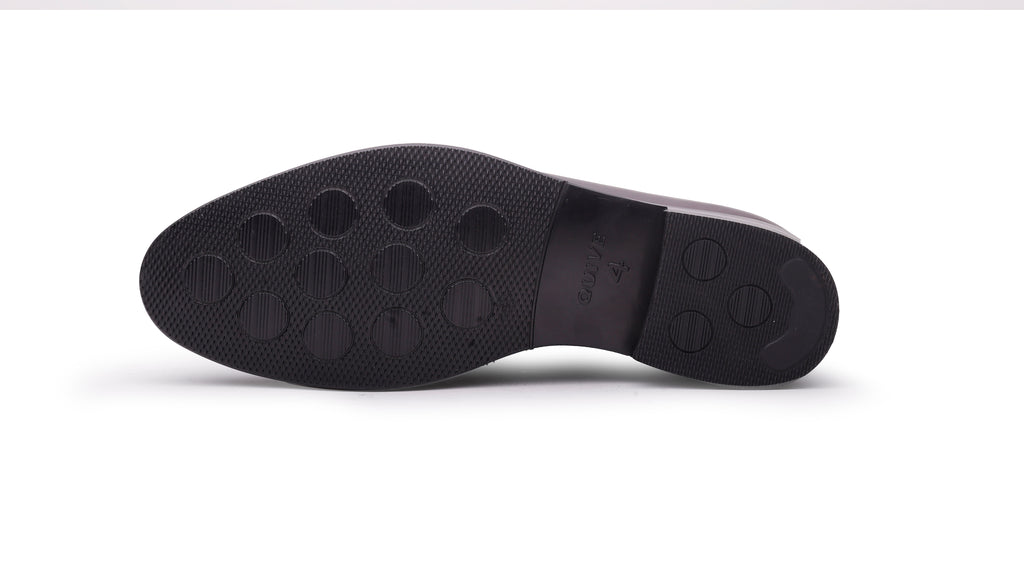 Outsole view of QUIVE London Ventor brown leather penny loafer