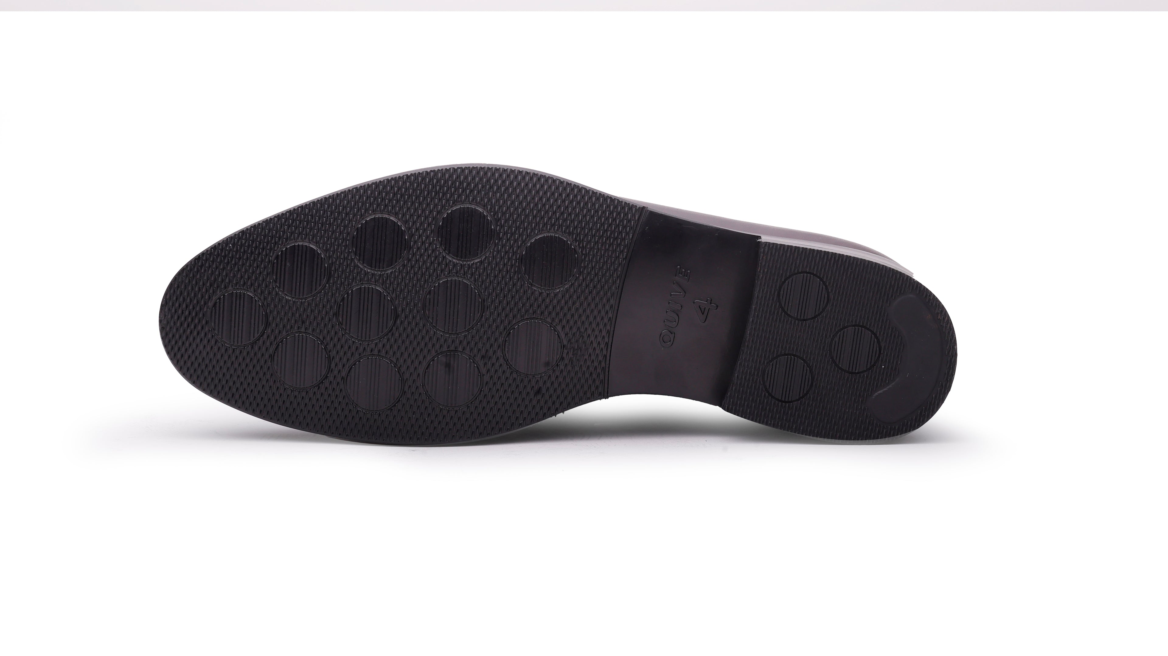 Outsole view of QUIVE London Ventor brown leather penny loafer