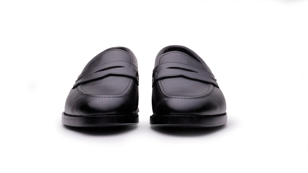 Front view of Ventor men's black leather penny loafers