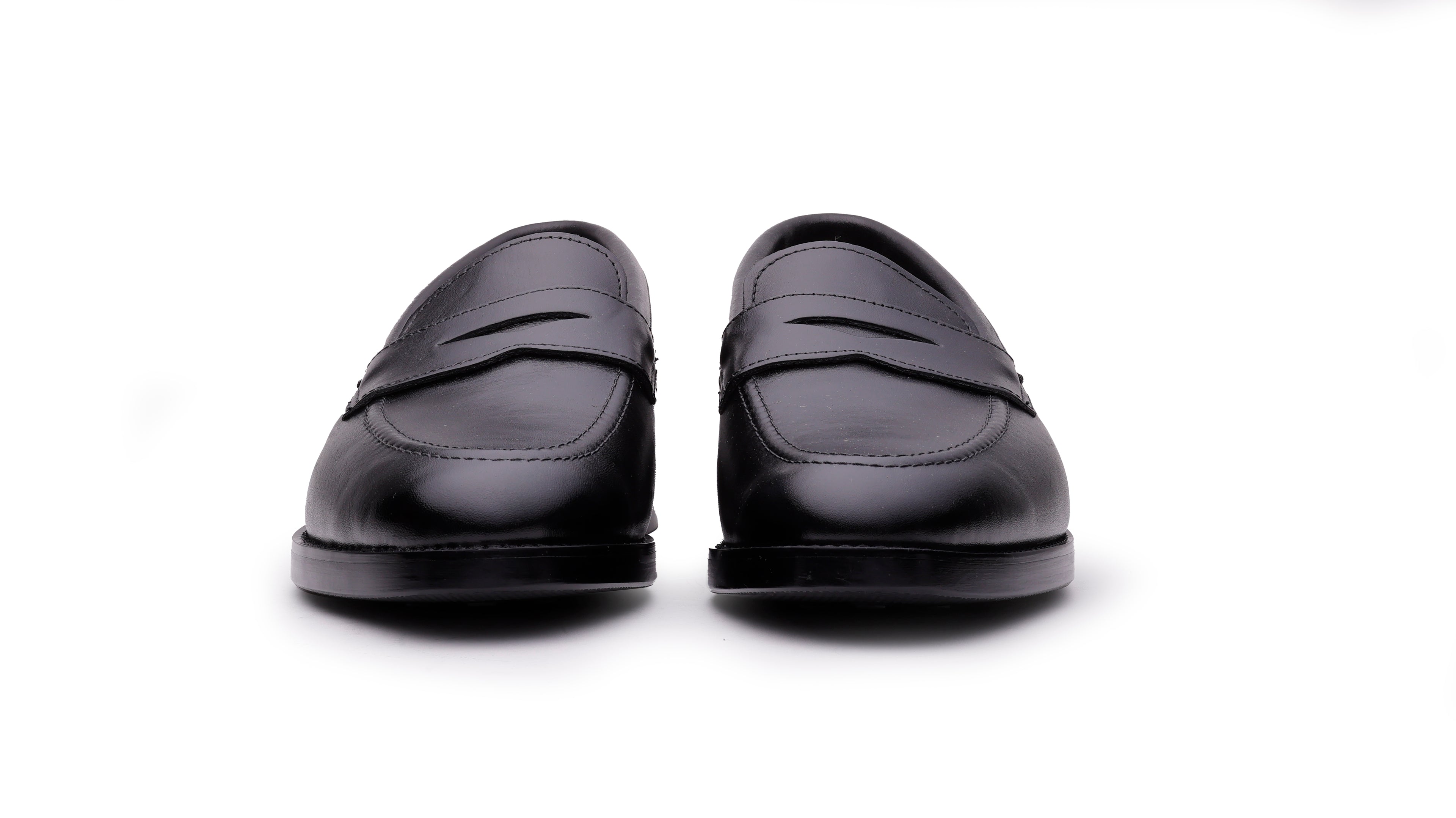 Front view of Ventor men's black leather penny loafers