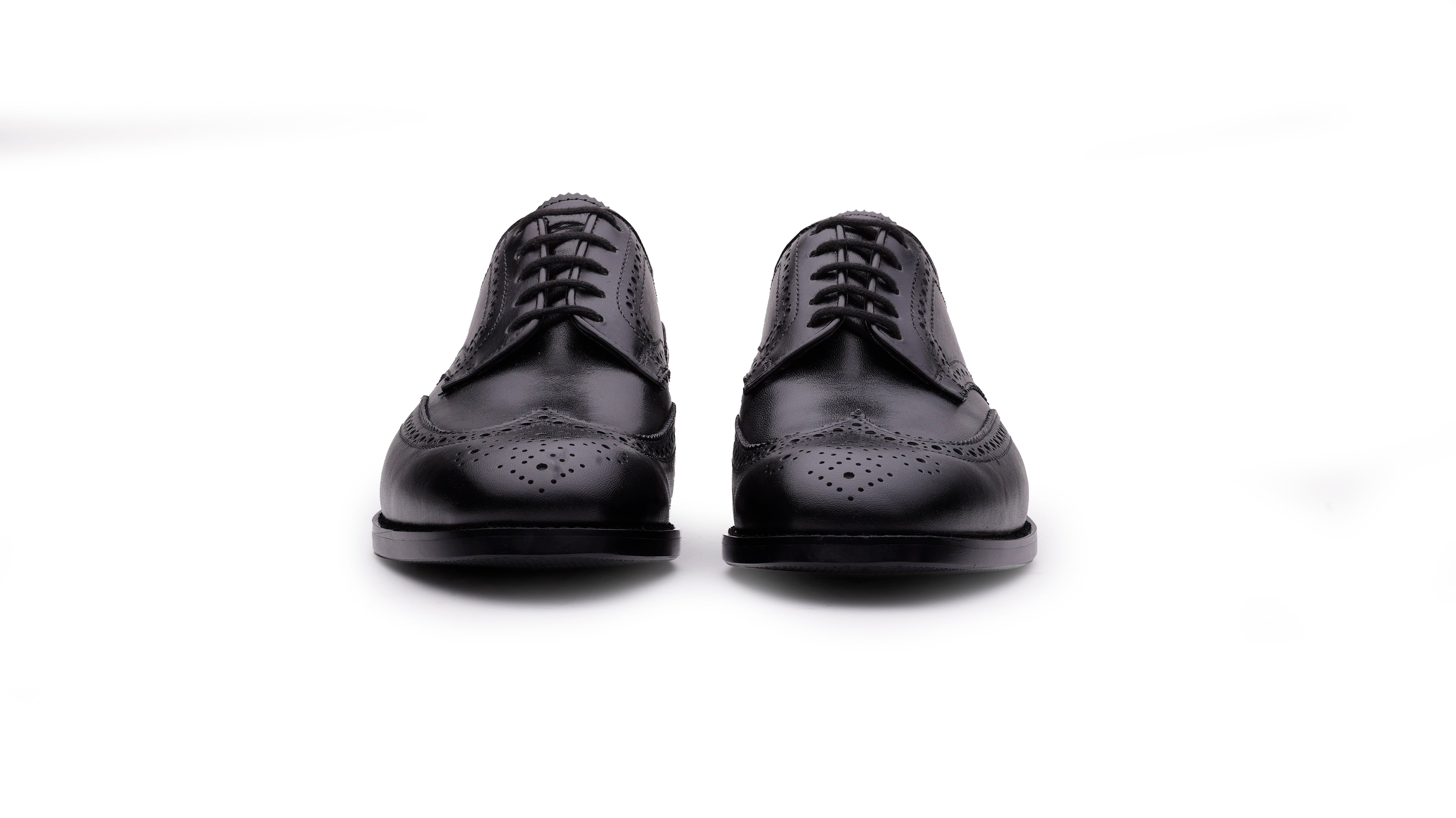 Front view of QUIVE London Kensington men's black leather wingtip Derby shoes