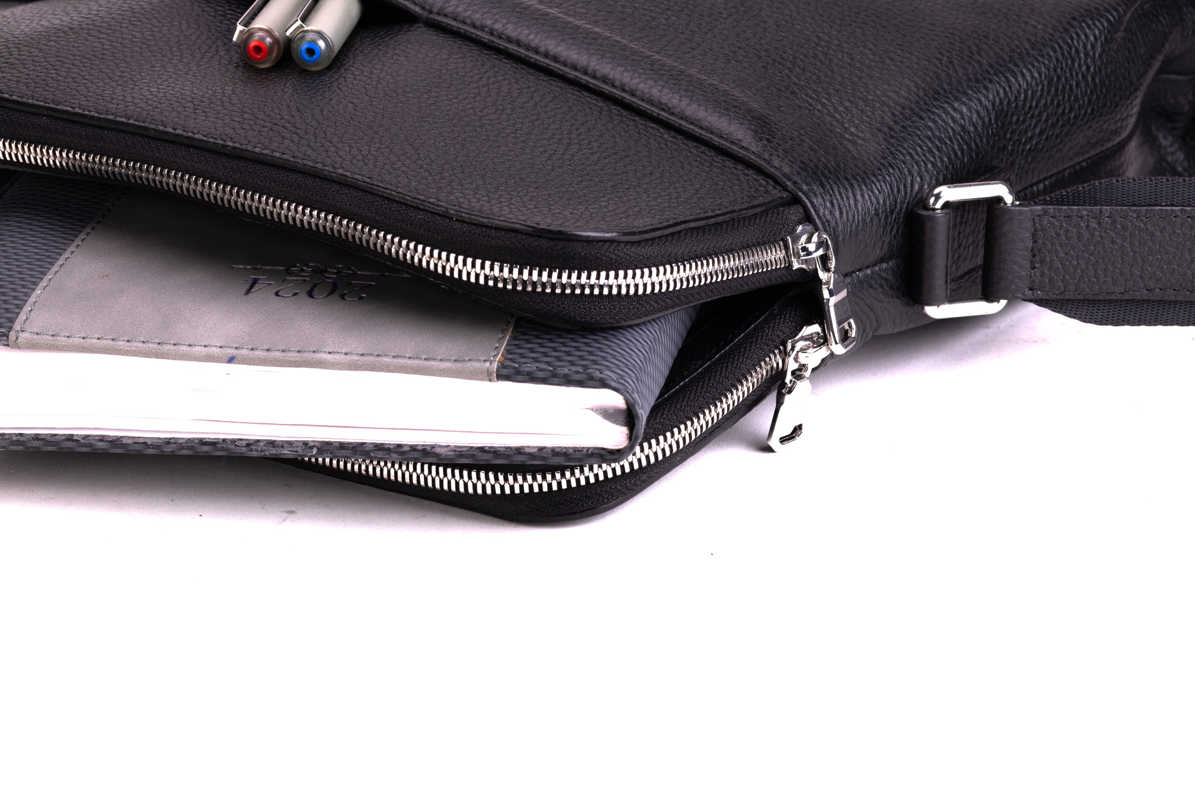 PORTMAN black leather crossbody bag open zip compartment and storage detail