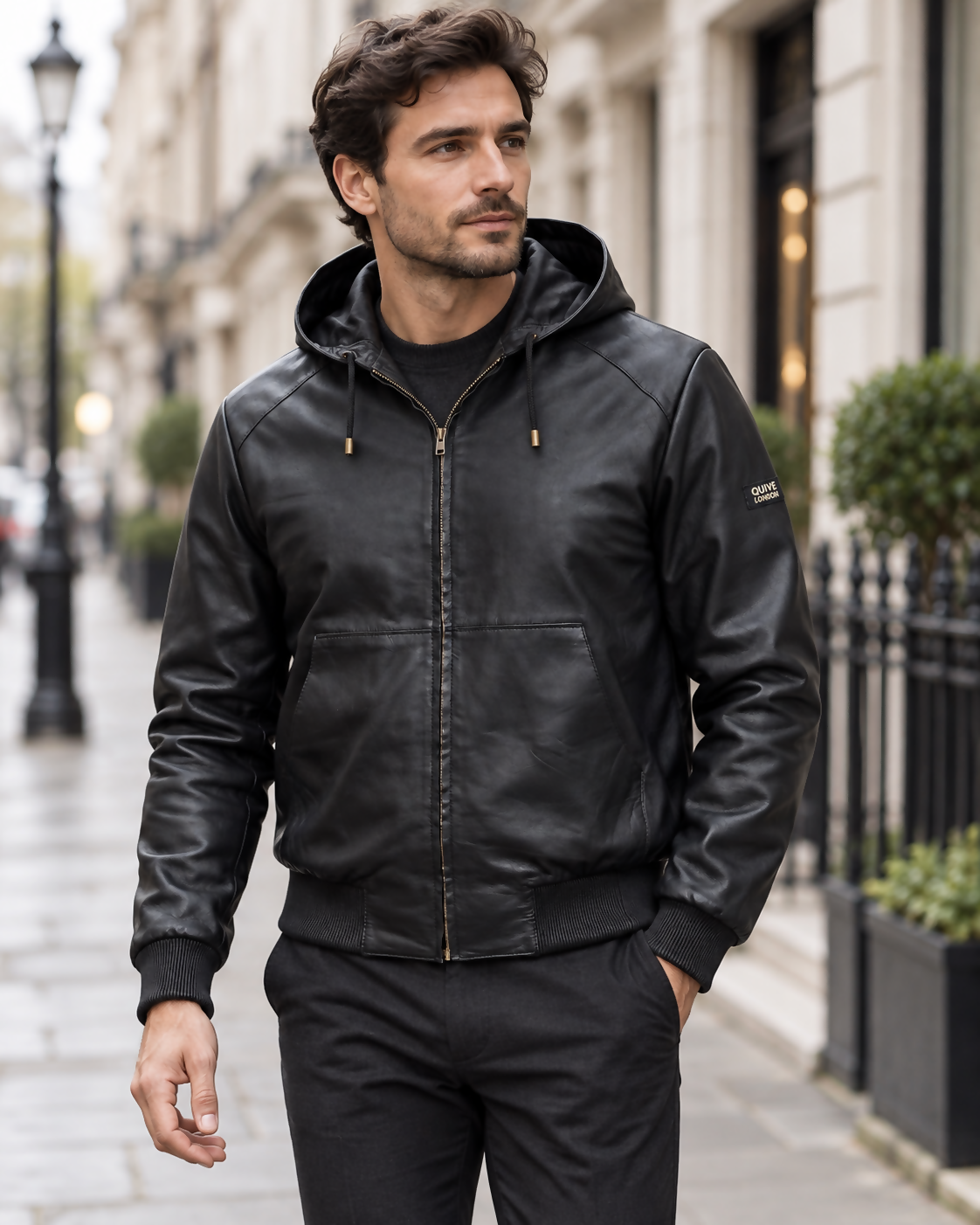 Man wearing the black KNIGHTSBRIDGE hooded leather jacket on a London street