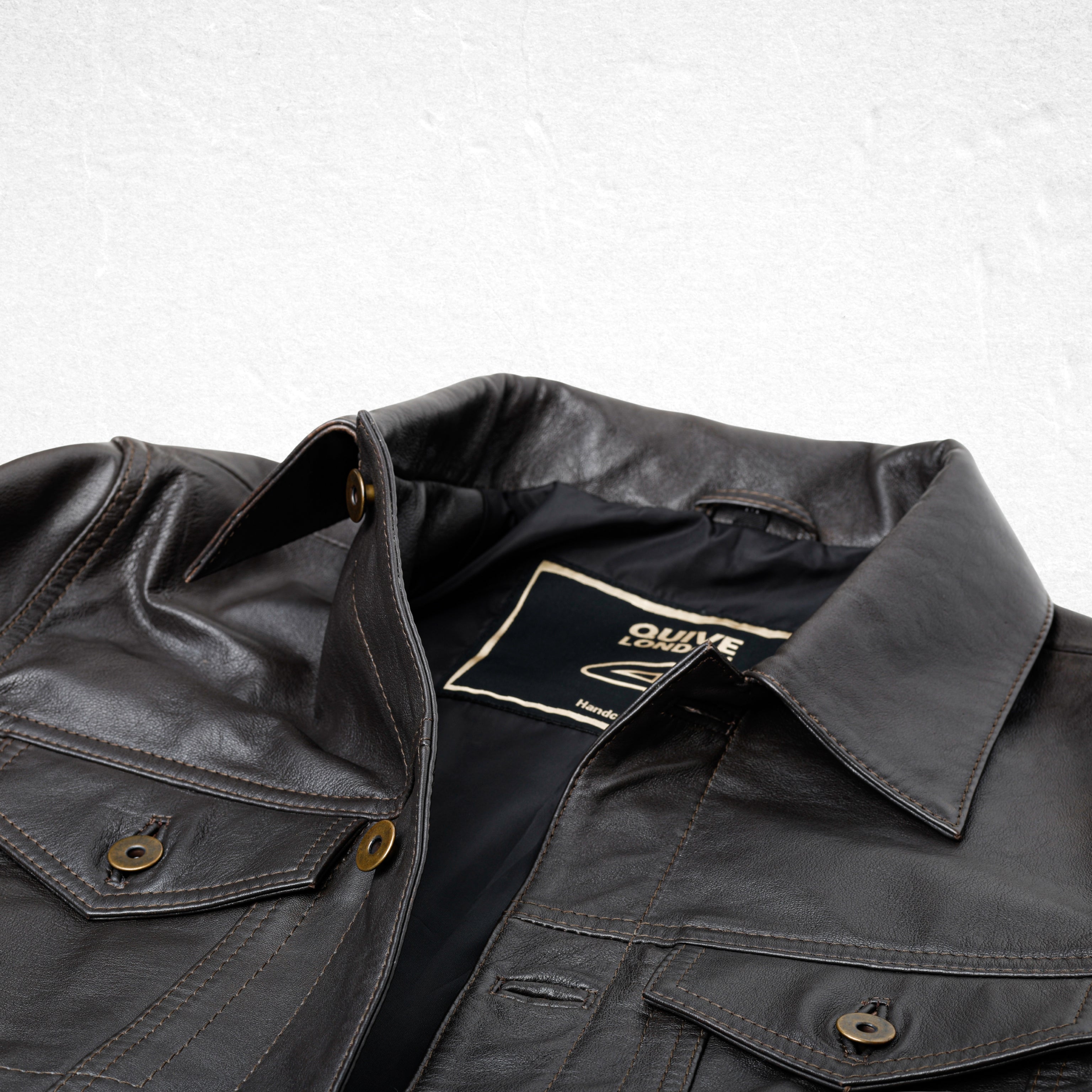 Brown BELGRAVE leather jacket collar and interior label detail