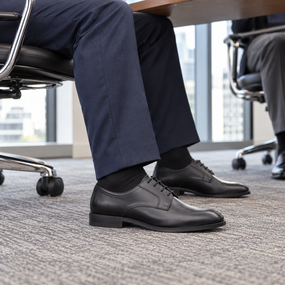 GROSVENOR black calf leather Derby shoes, side view worn during a boardroom meeting