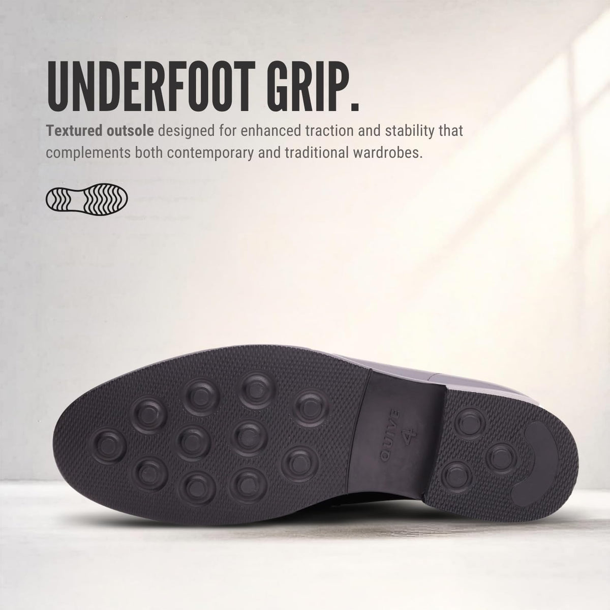 Outsole view of REGENT black leather penny loafers