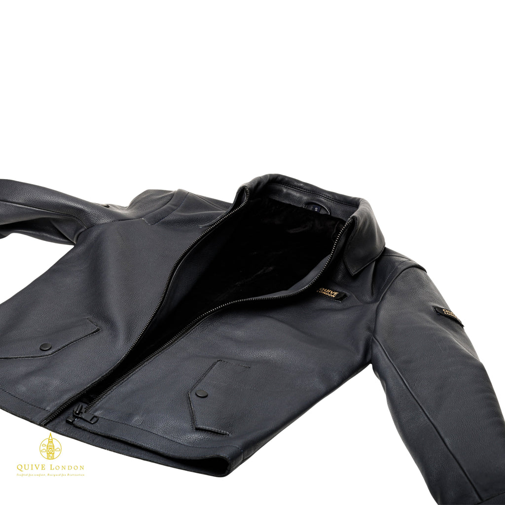 SLOANE black leather utility jacket laid flat showing flap pockets